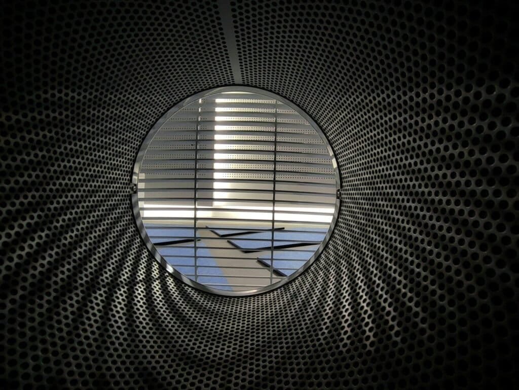 An Airplane Is Seen Through A Circular Window