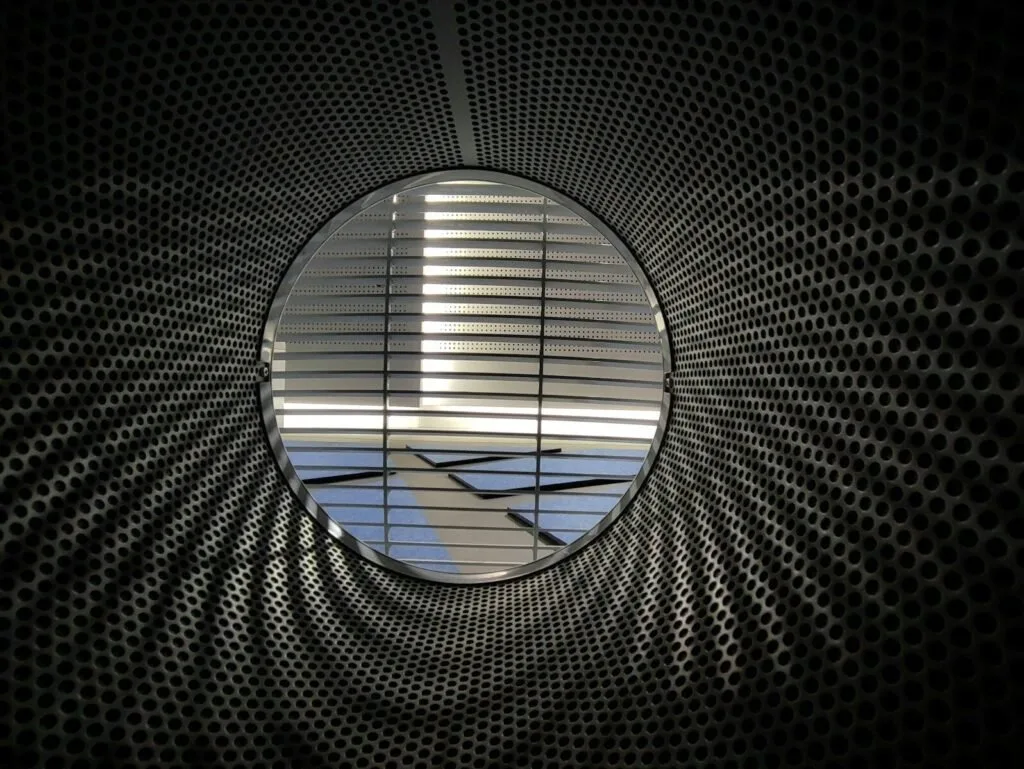 An Airplane Is Seen Through A Circular Window