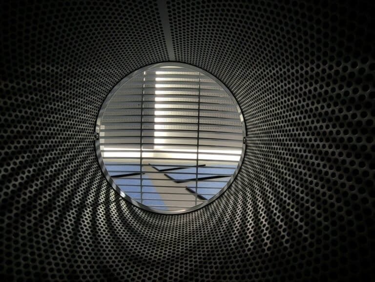 An Airplane Is Seen Through A Circular Window