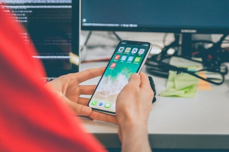 Person Using Silver Iphone X