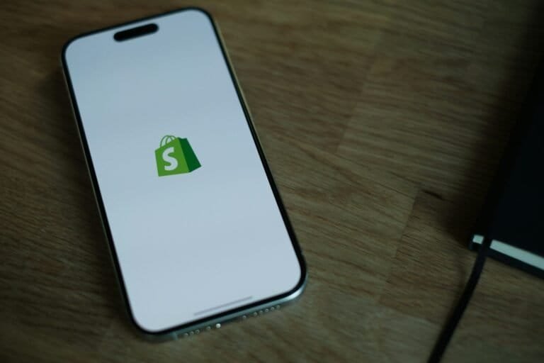 A Cell Phone Sitting On Top Of A Wooden Table