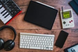 black ipad beside apple keyboard and apple magic mouse